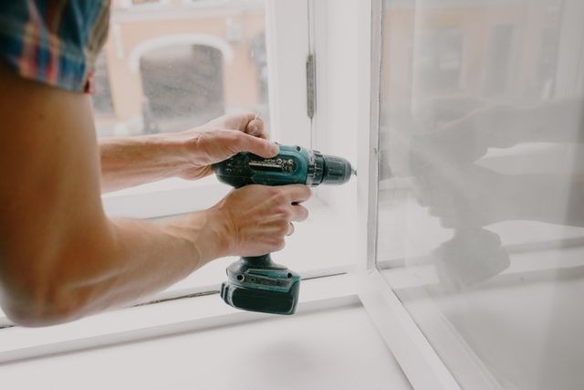 person using a drill